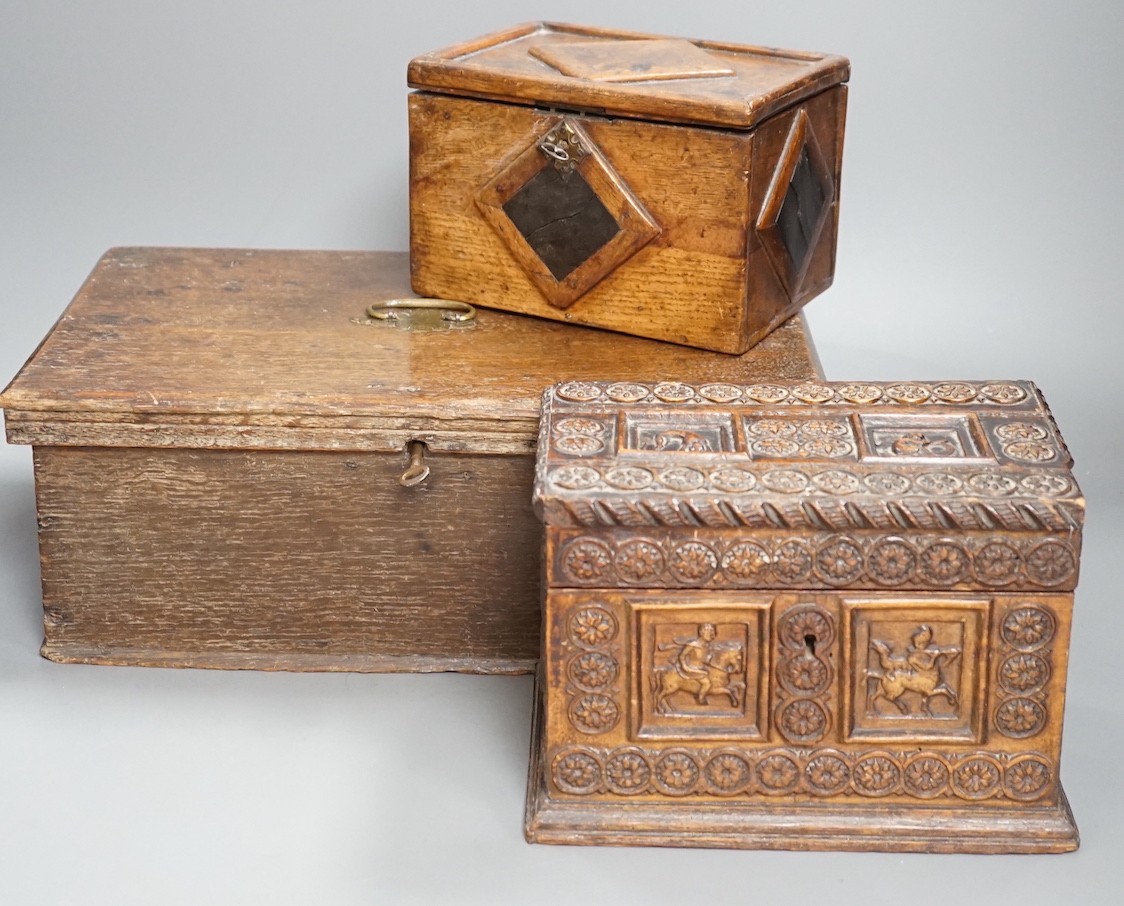 An early 18th century oak bible box containing a Victorian Morocco leather photograph album, together with two 19th century wooden boxes (4)